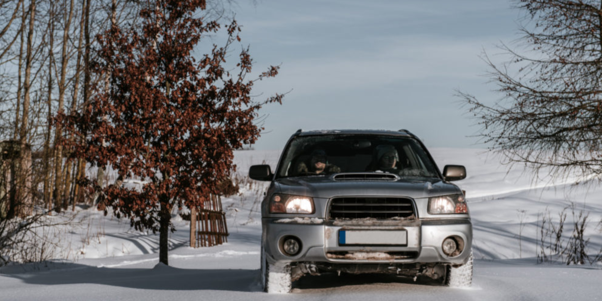 4 wheel drive vehicle in the snow