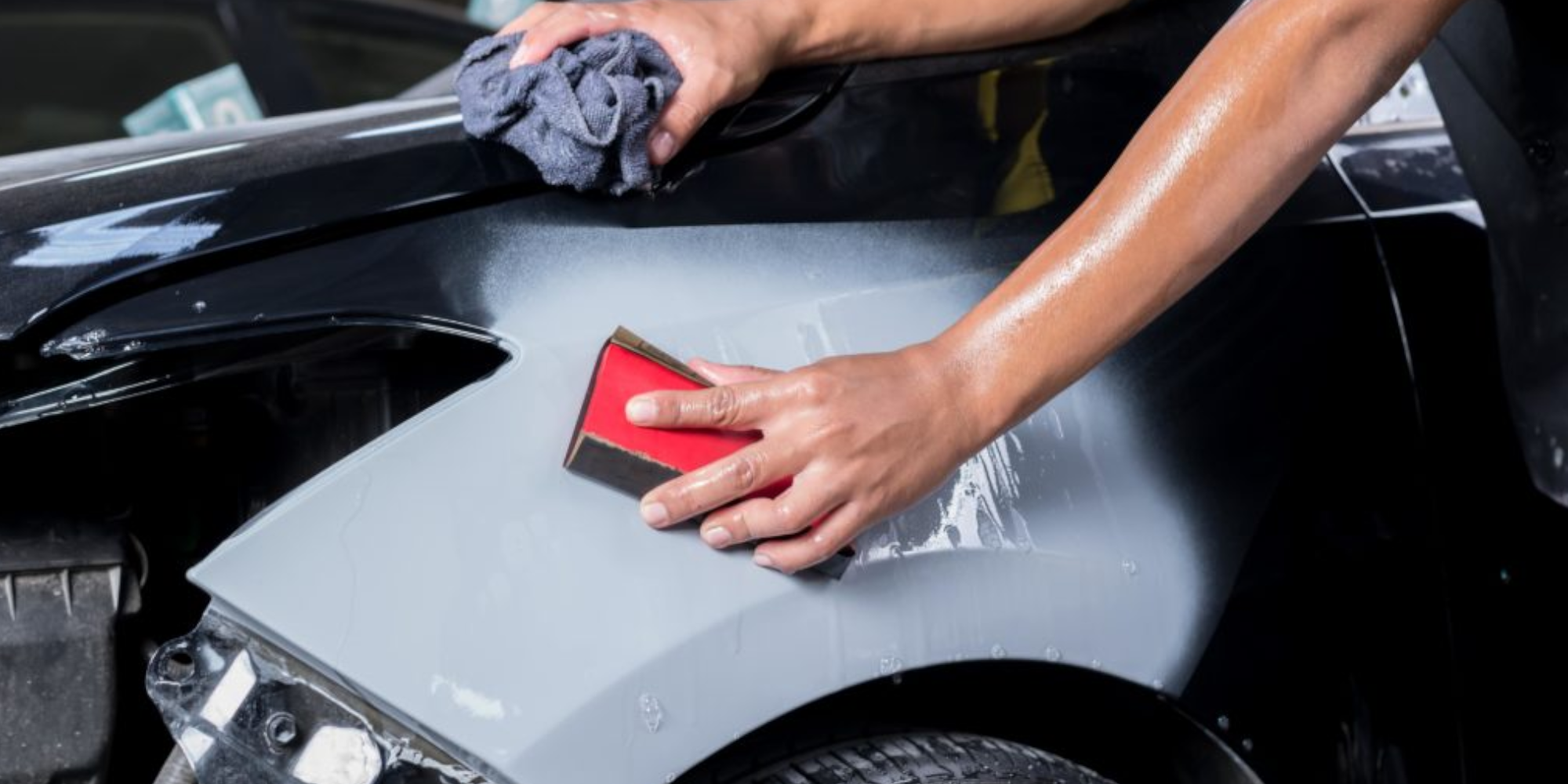 person cleaning car